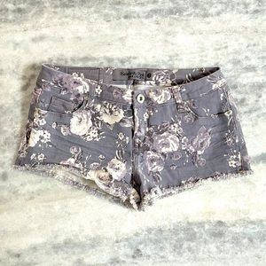 Floral print Jean shorts with raw edge. Size 7.